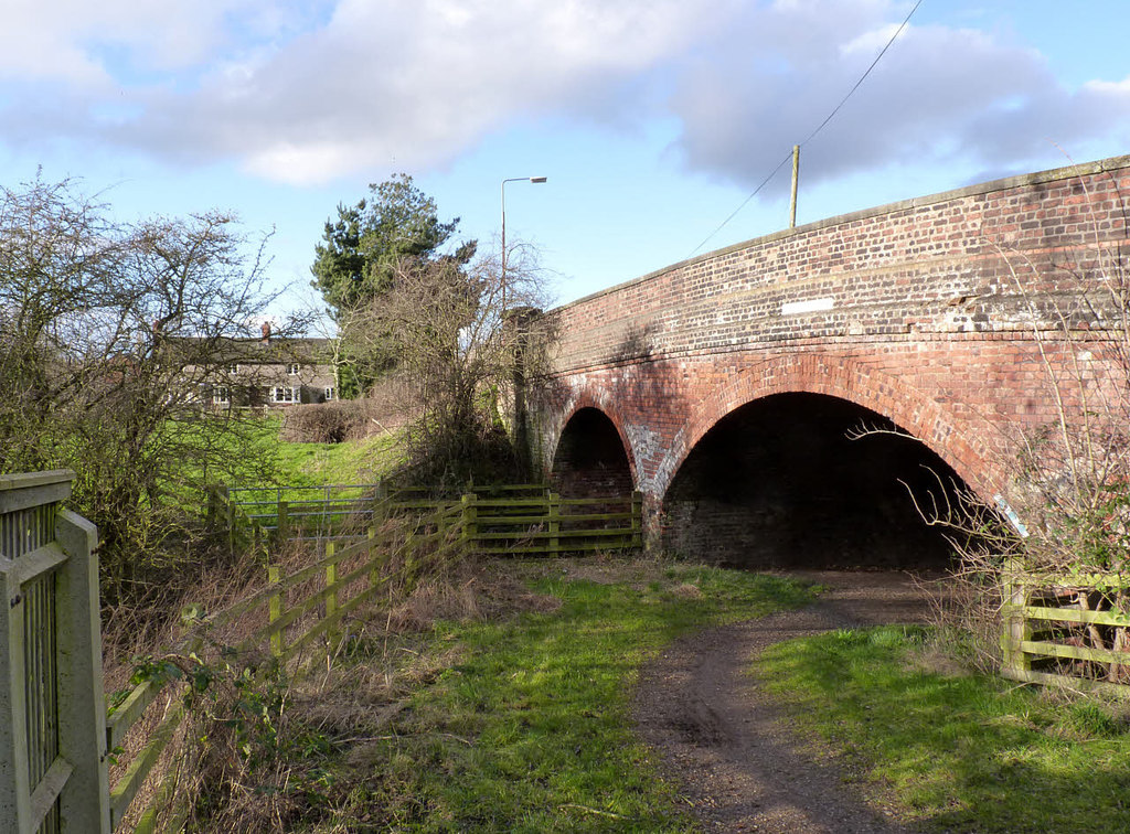 The brick arch of Egginton Junction Bridge beside the cycleway